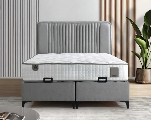 Elegante cama gris con colchón de textil y madera