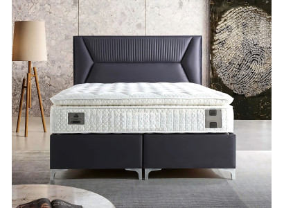 Cama elegante gris con colchón de textil y madera