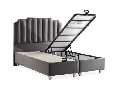 Elegante cama gris con colchón de textil y madera