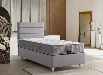 Elegante cama gris con colchón de textil y madera