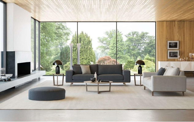 Sofá de salón gris de lujo de tres plazas estilo moderno con tapizado.
