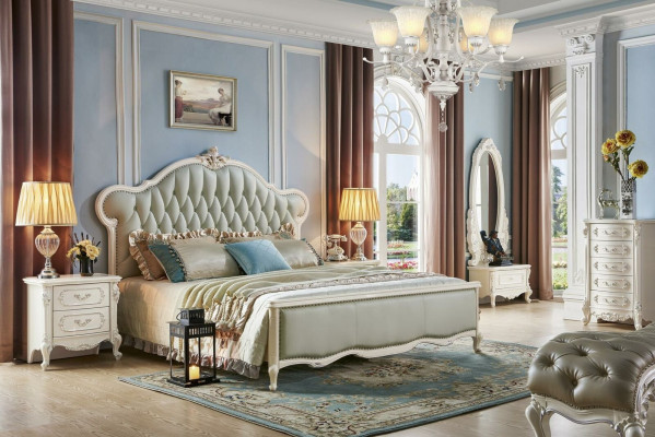 Elegante cama Chesterfield en estilo clásico con mesitas de noche a juego.