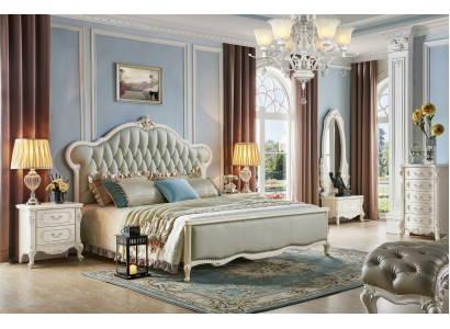 Elegante cama Chesterfield en estilo clásico con mesitas de noche a juego.