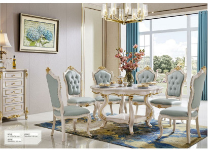 Ambiente clásico de comedor en azul claro Mesa redonda de madera con x6 sillas de respaldo Chesterfield.