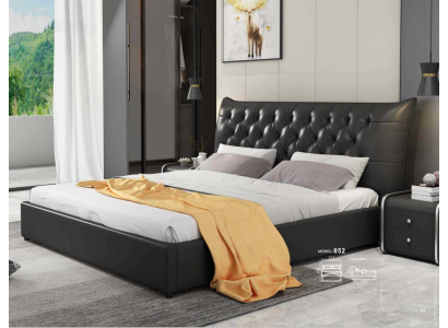 Cama doble de diseñador en cuero de lujo para hotel.