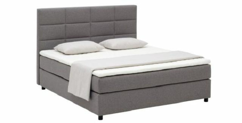 Cama boxspring continental para camas dobles en cuero acolchado alto.