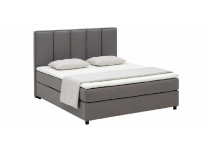 Cama con somier de caja continental acolchada doble de cuero textil.