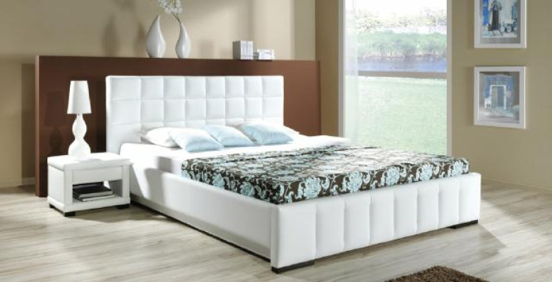 Una lujosa cama de diseño en un estilo contemporáneo sofisticado de la más alta calidad.