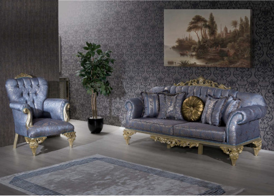 Sofá clásico y exigente en diseño Chesterfield para la sala de estar con cojines dorados.