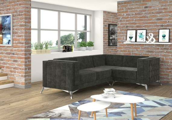 Sofá esquinero Chesterfield en forma de L de diseño de tela con asiento acolchado.