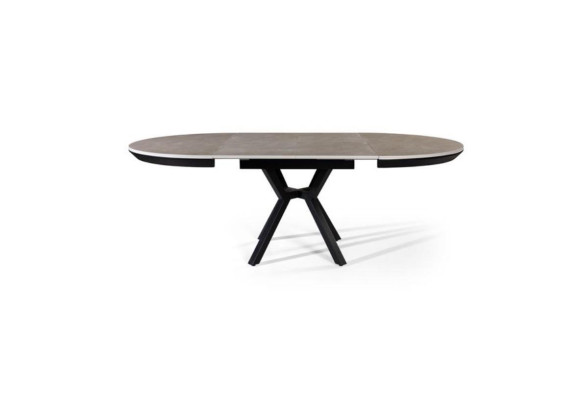 Mesa de comedor redonda extensible en madera gris.