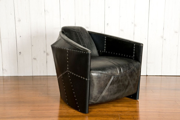 Mueble de avión vintage, sillón de cuero negro auténtico de diseño retro.