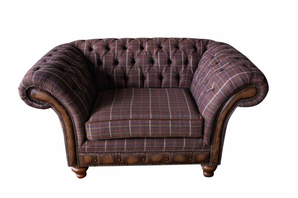 Chesterfield sofá de 1 asiento tapizado de tela de lujo.