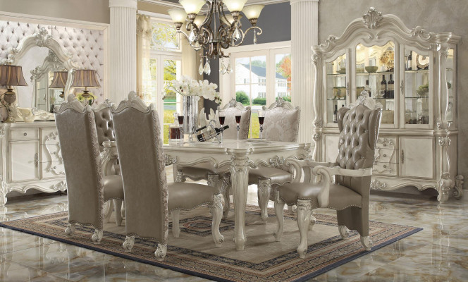 Juego de comedor blanco de diseñador: mesa de comedor, sillas, cómoda y espejo.