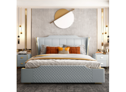 Cama de lujo con acolchado de diseño. Habitación doble de hotel. Cuero artificial.