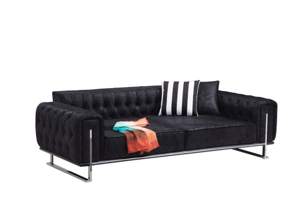 Sofá de tres plazas diseño Chesterfield de lujo para salón.