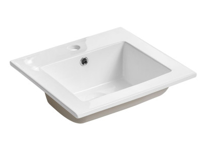 Lavabo de cerámica blanco sobre encimera de lavabo integrado