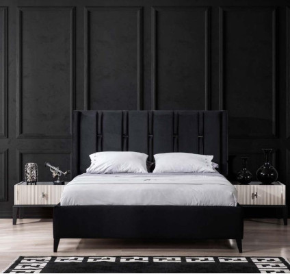 Juego de dormitorio en blanco y negro con cama doble, mesitas de noche y cama tapizada.