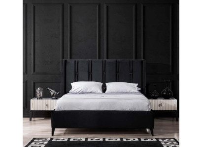 Juego de dormitorio en blanco y negro con cama doble, mesitas de noche y cama tapizada.