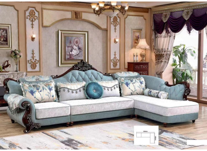 Sofá esquinero clásico de tela Chesterfield con cojines de esquina.