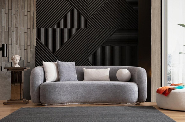 Moderno sofá gris de diseño moderno de cuatro plazas con sofá tapizado y reposapiés nuevos.