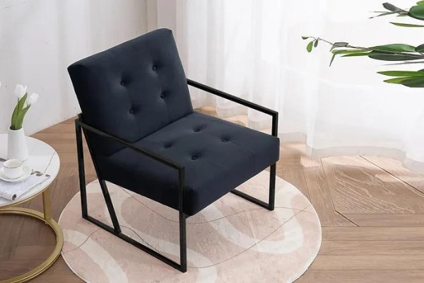 Acogedor sillón negro en textil nuevo de alta calidad de metal.