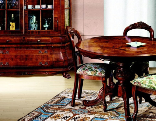 Mesa de comedor redonda extensible de lujo de madera italiana.