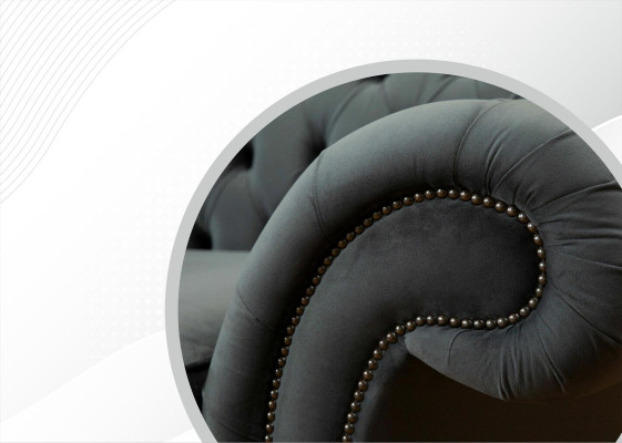 Sofá Chesterfield XXL de 4 plazas con tapizado en cuero textil.