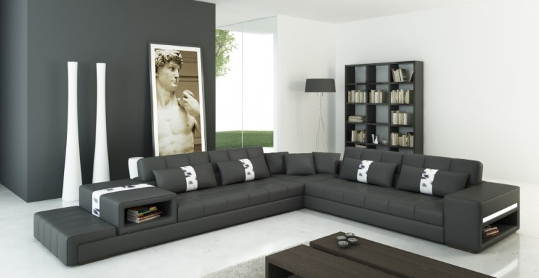 Moderna sensación de vivienda sofá esquinero en forma de L en gris oscuro con elegante tapizado de cuero sintético.