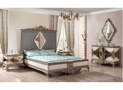 Conjunto de dormitorio clásico de alta calidad con cama doble, cómoda y sofá.