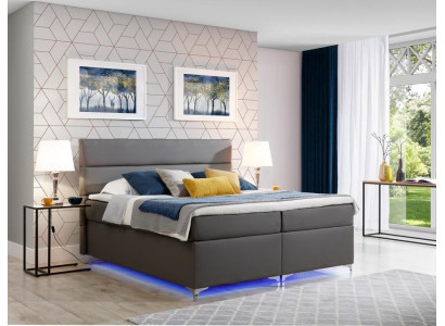Cama de muelles tapizada 180x200 de cuero para dormitorio de matrimonio.