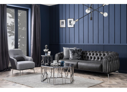 Sofá Chesterfield de 4 plazas en cuero negro artificial.