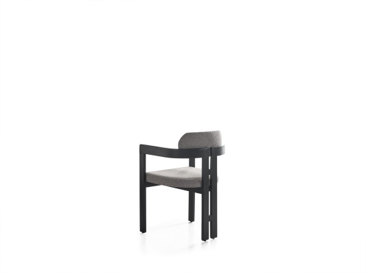 Una silla ultramoderna con una forma inusual e interesantes patas con un cómodo respaldo en gris y negro para el comedor.