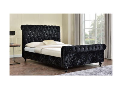Cama negra Chesterfield de gran tamaño de 140x200 para dormitorio con tapizado acolchado.