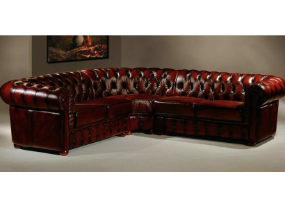 Sofá de esquina Chesterfield de diseñador en terciopelo y cuero.