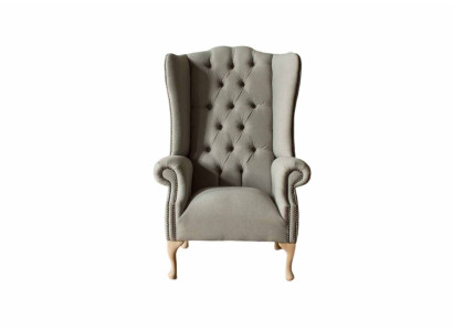 Sillón gris de orejas diseño tapizado Chesterfield textil sala de estar