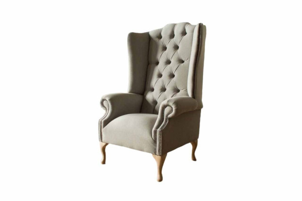 Sillón gris de orejas diseño tapizado Chesterfield textil sala de estar