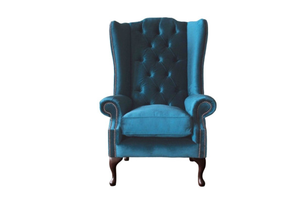 Sillón de orejas gris diseño tapizado Chesterfield textil salón
