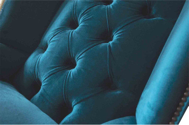 Sillón de orejas gris diseño tapizado Chesterfield textil salón