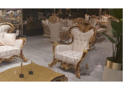 Sillón de orejas clásico de lujo en diseño barroco blanco y dorado.