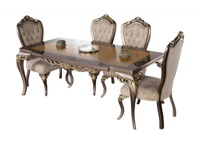 Mesa de comedor clásica de madera maciza con adornos elaborados.
