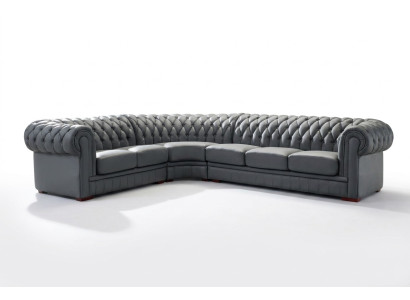 Sofá esquinero clásico Chesterfield tapizado en cuero con decoración de costuras.
