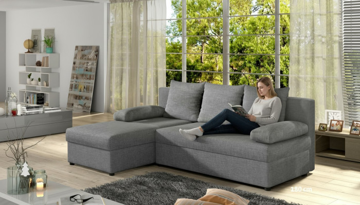 Sofá cama moderno de esquina tapizado en tela con asientos acolchados de cuero y tela.