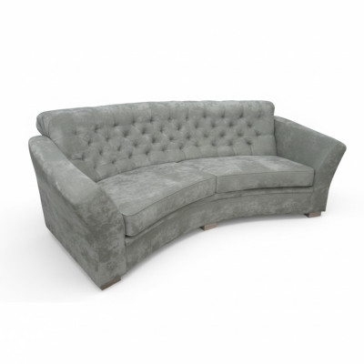 Sofá Chesterfield semicircular de tres plazas en color beige.