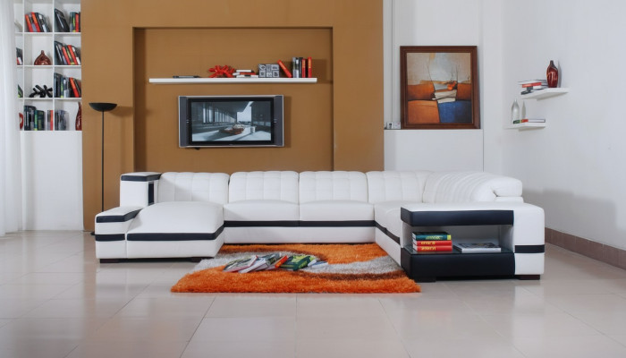 Sofá de diseñador esquinero con otomana, conjunto de sofá de salón acolchado.