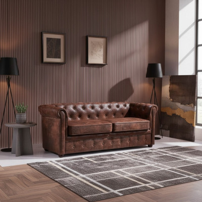 Sofá Chesterfield de lujo de cuero artificial para la sala de estar.