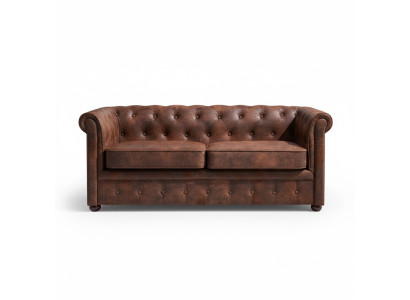 Sofá Chesterfield de lujo de cuero artificial para la sala de estar.