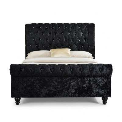 Cama negra Chesterfield de gran tamaño de 140x200 para dormitorio con tapizado acolchado.