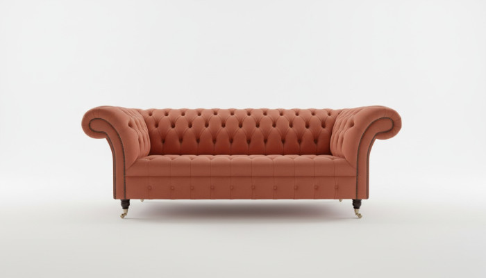 Lujo Chesterfield sofá de tres plazas en naranja diseño de salón de alta gama.