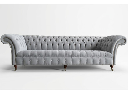 Clásico sofá Chesterfield de 4 plazas en cuero gris de diseño acolchado.
